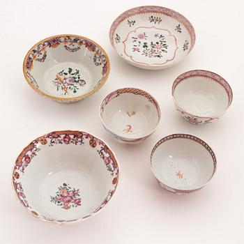 A group of seven famille rose cups with saucers, two bowls and two small dishes, Qing dynasty, Qianlong (1736-95).