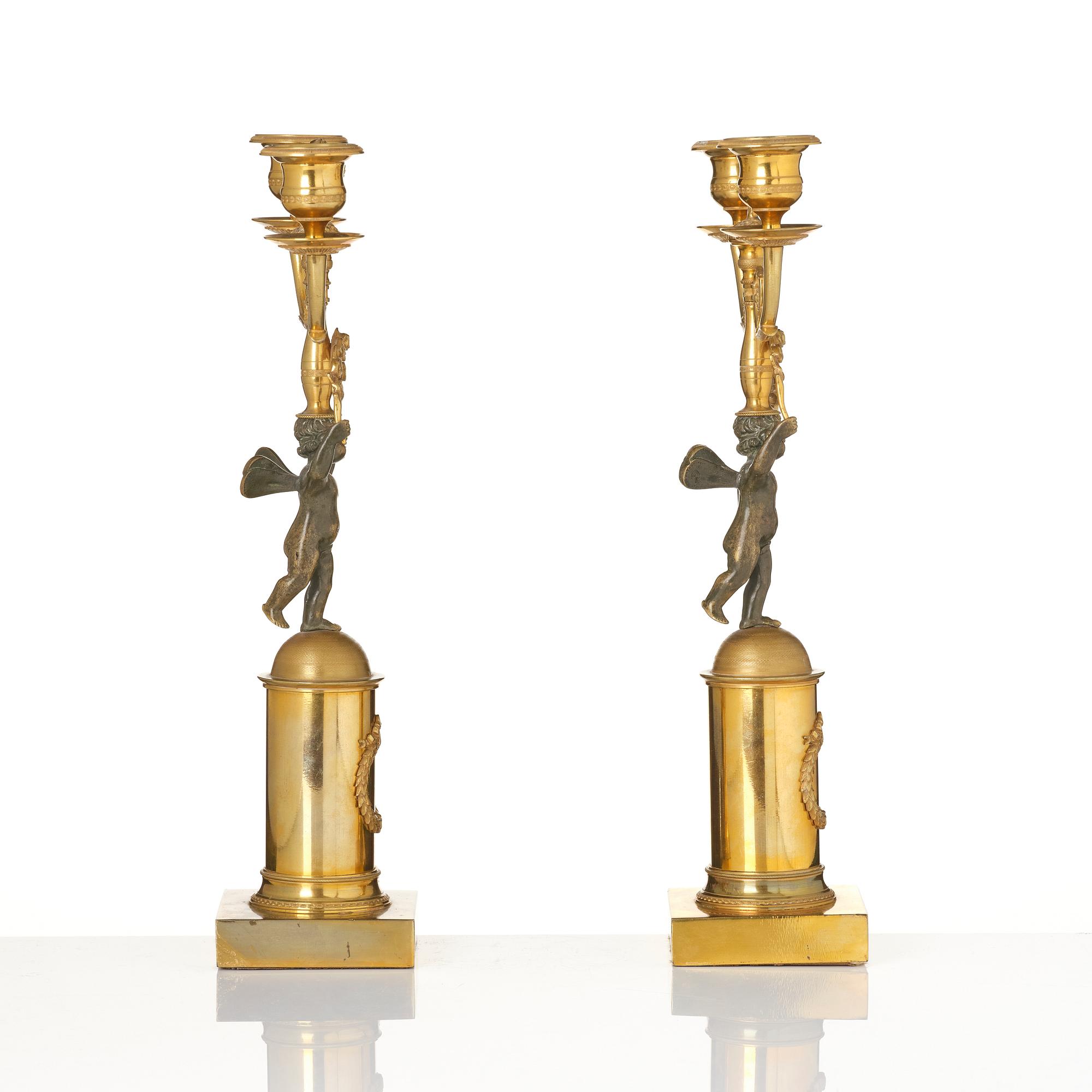 A pair of Empire gilt-brass two-branch candelabra, Stockholm, early 19th century.