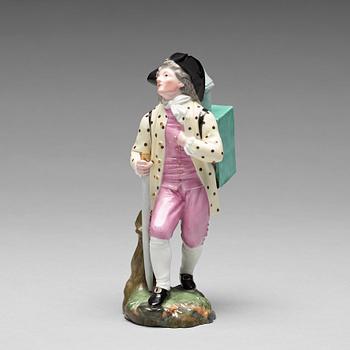 A porcelain figure of a man with a walking staff, 'Höchst mark', 19th Century.