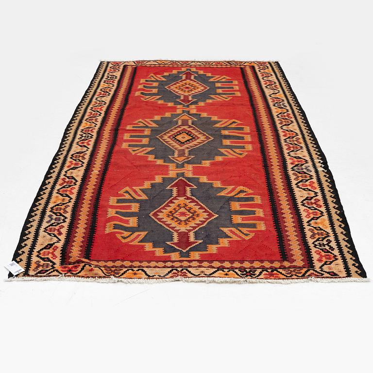 A Kilim rug, c. 300 x 165 cm.