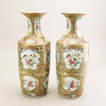 A pair of Chinese kanton vases later part of the 19th century porcelain.