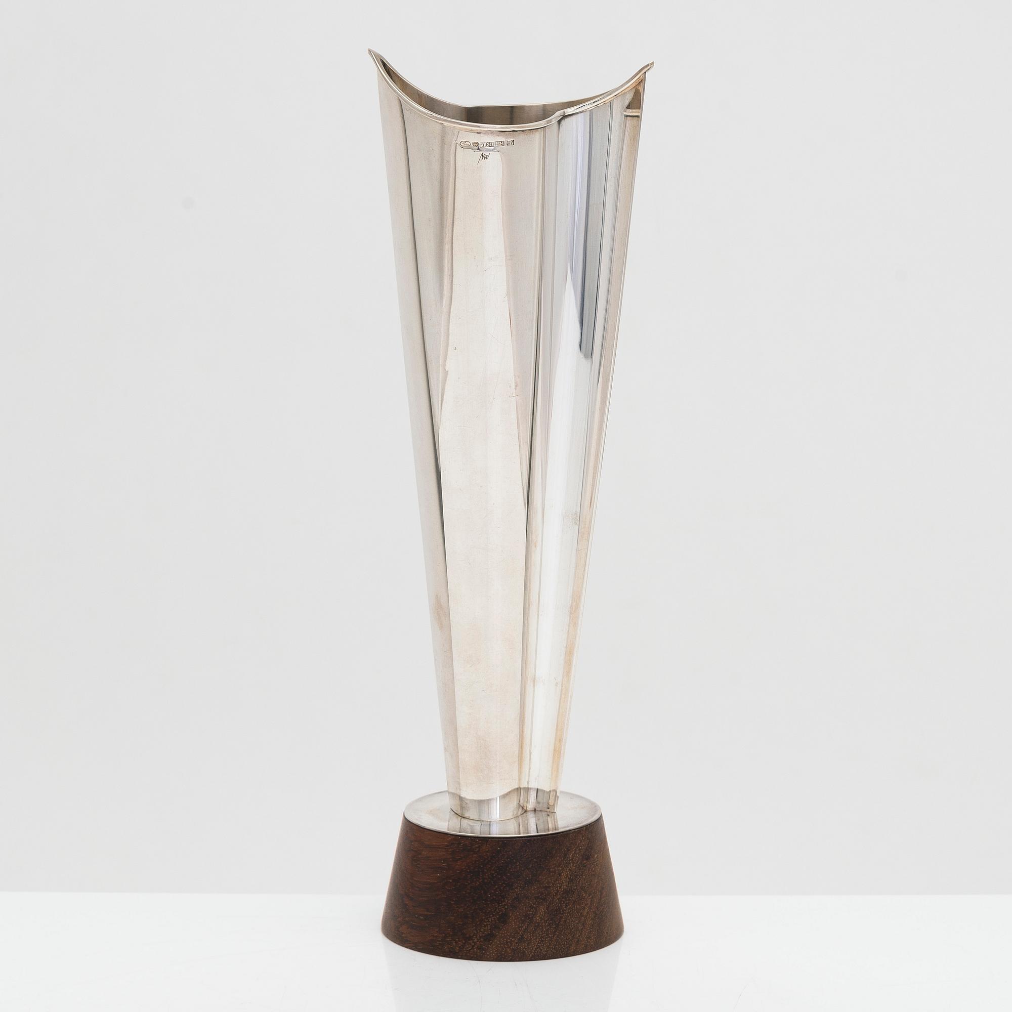 Tapio Wirkkala, a 'Liekki' (Flame) silver vase on a rosewood base, model TW 228, Kultakeskus, Hämeenlinna 1963.