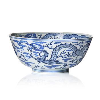 1347. A blue and white four clawed dragon bowl, Qing dynasty with a four character mark of Xuande.
