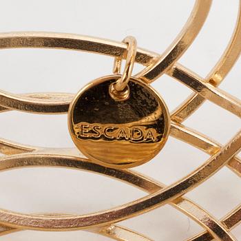 ESCADA, a golden bracelet.