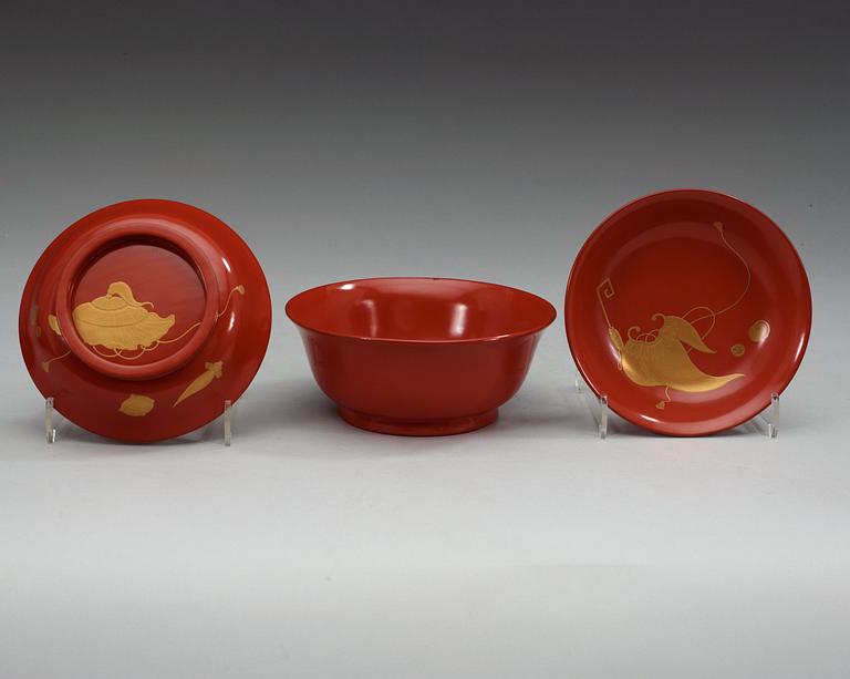A set of eight red lacquered Japanese bowls with covers, first half of 20th Century.