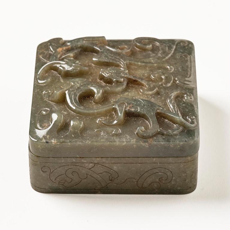 A well carved green stone box with cover, China, 20th century.