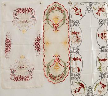 A collection of smaller Christmas tablecloths, runners, and wall hangings, approximately 34 pieces, mid/second half of the 20th century.