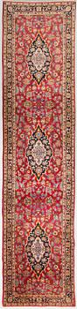 An oriental runner. Circa 413x97 cm.