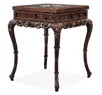 1332. A hardwood games table, late Qing dynasty (1644-1912).