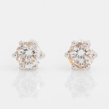 Brilliant cut diamond stud earrings.