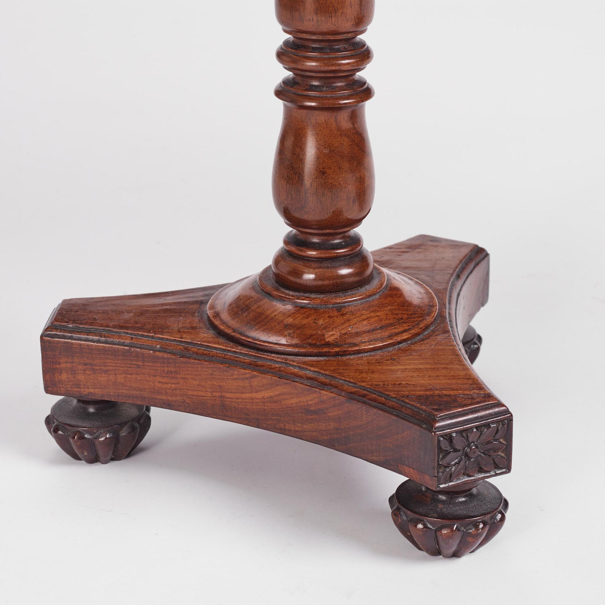 A near pair of Regency rosewood gueridon tables in the manner of Thomas Hope (1769-1831).