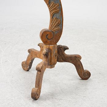 A carved wood floor candlestick, circa 1900 composed of 18th century elements.