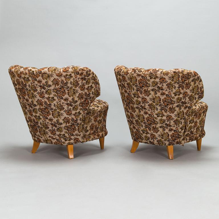 A pair of 1950's armchairs.