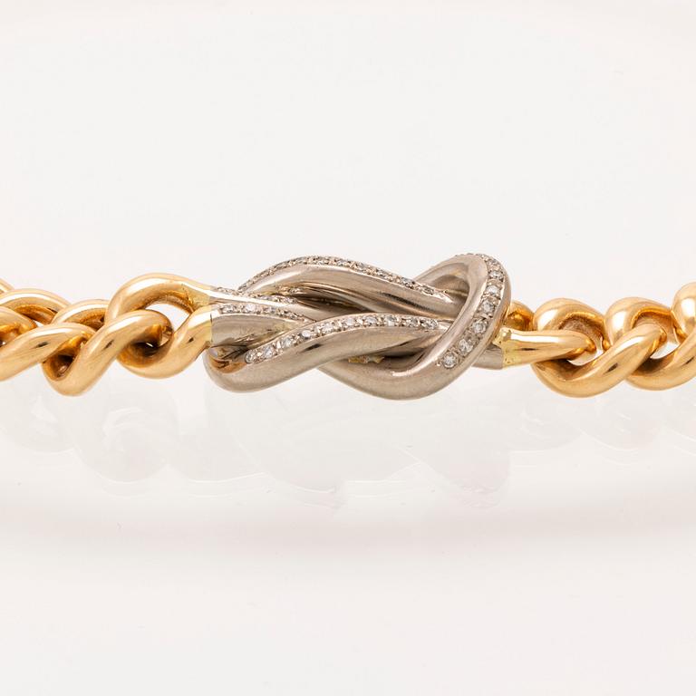 An 18K gold necklace weight 183,6 grams, 0,4 ct brilliants.