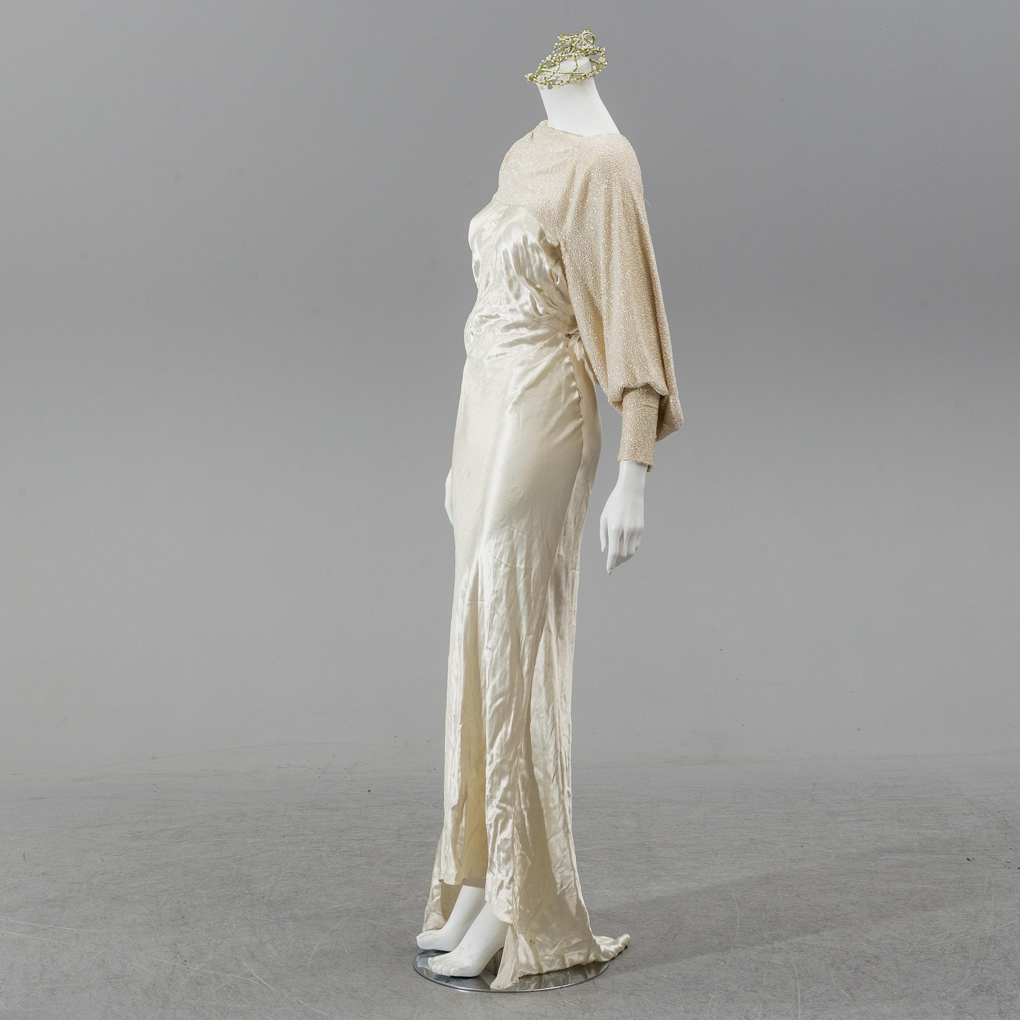 A satin wedding dress, circa 1935.
