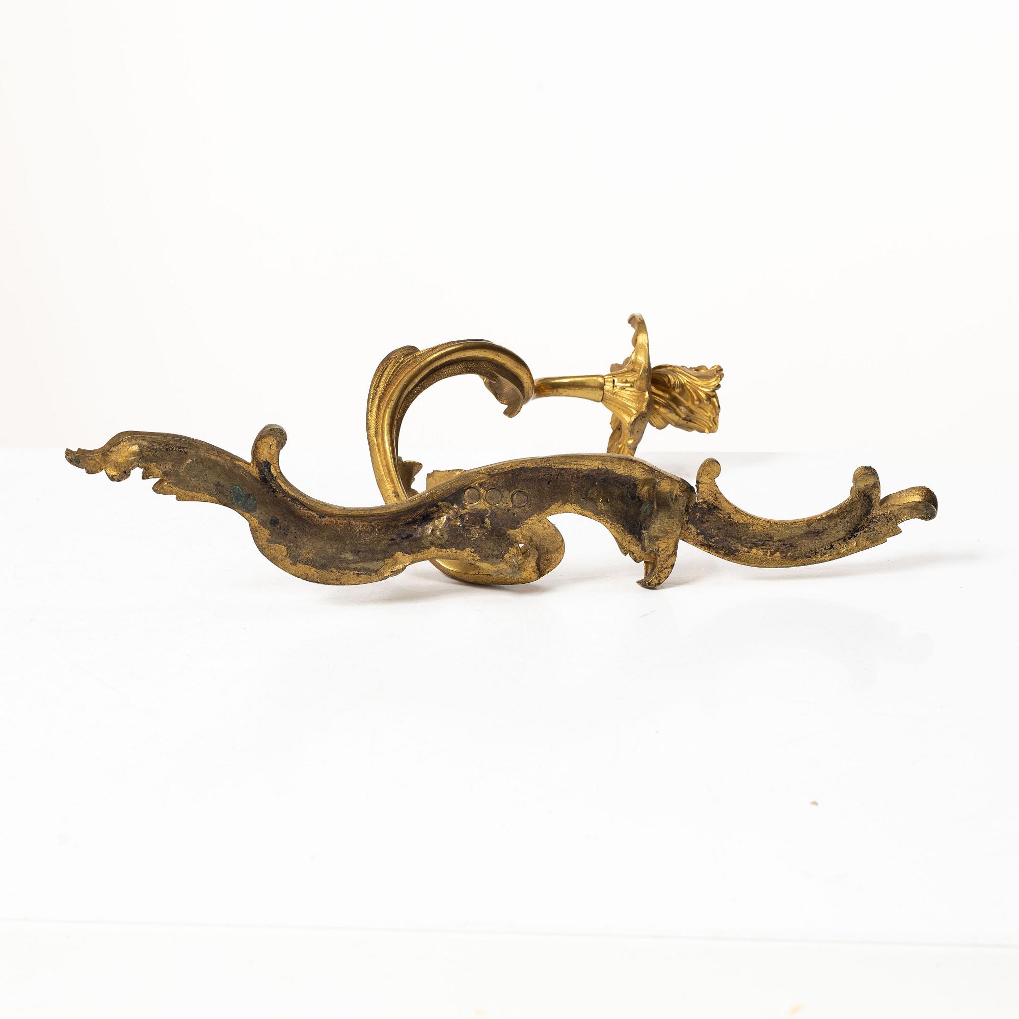 A pair of Rococo-style appliques, France, circa 1900.