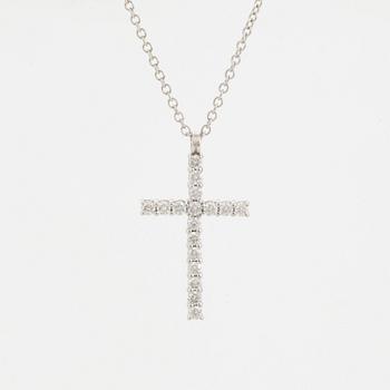 Brilliant-cut diamond cross pendant.