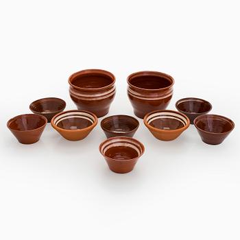 A set of ten redclay servingbowls.
