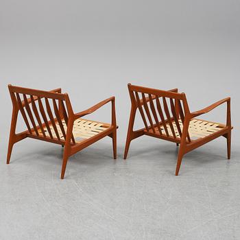 A pair of late 20th Century easy chairs.