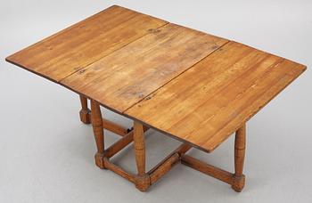 A drop-leaf table, 18th Century.