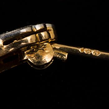BROSCH, 18 k guld samt platina med briljantslipad diamant samt rosenstenar, Art Decó ca 1930-talet. Vikt ca 4,5 g.