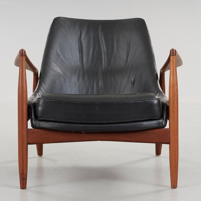 Ib Kofod-Larsen, a 'Seal' teak and black leather armchair, Olof Persson Möbler, Jönköping, Sweden 1950's-60's.