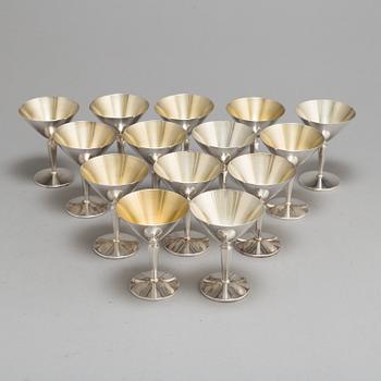 A SET OF 14 SILVER COCKTAILGLASSES, 1960s.