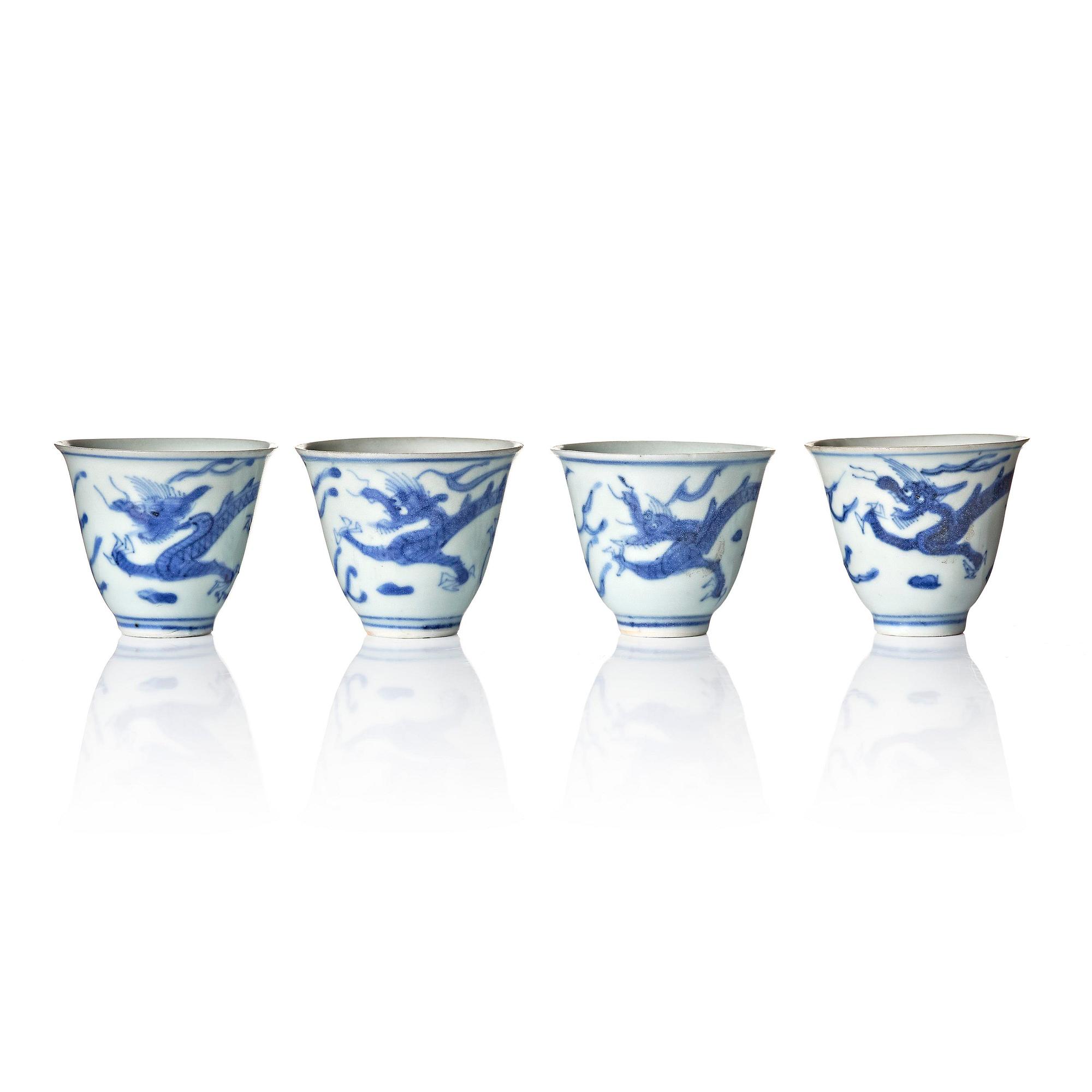 A set of four blue and white dragon wine cups, 'Hatcher Cargo', 17th century.