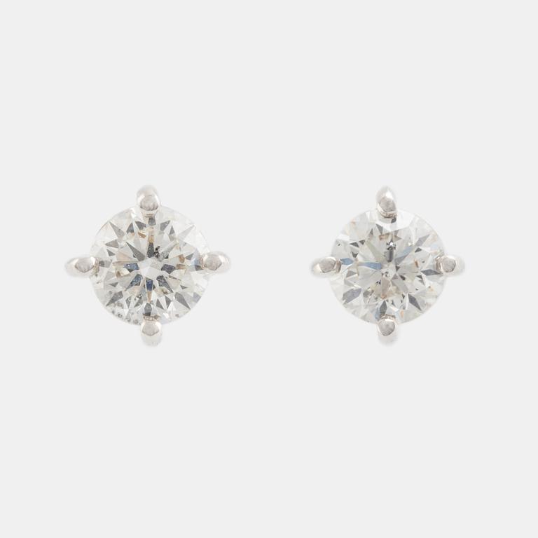Brilliant cut diamond stud earrings.