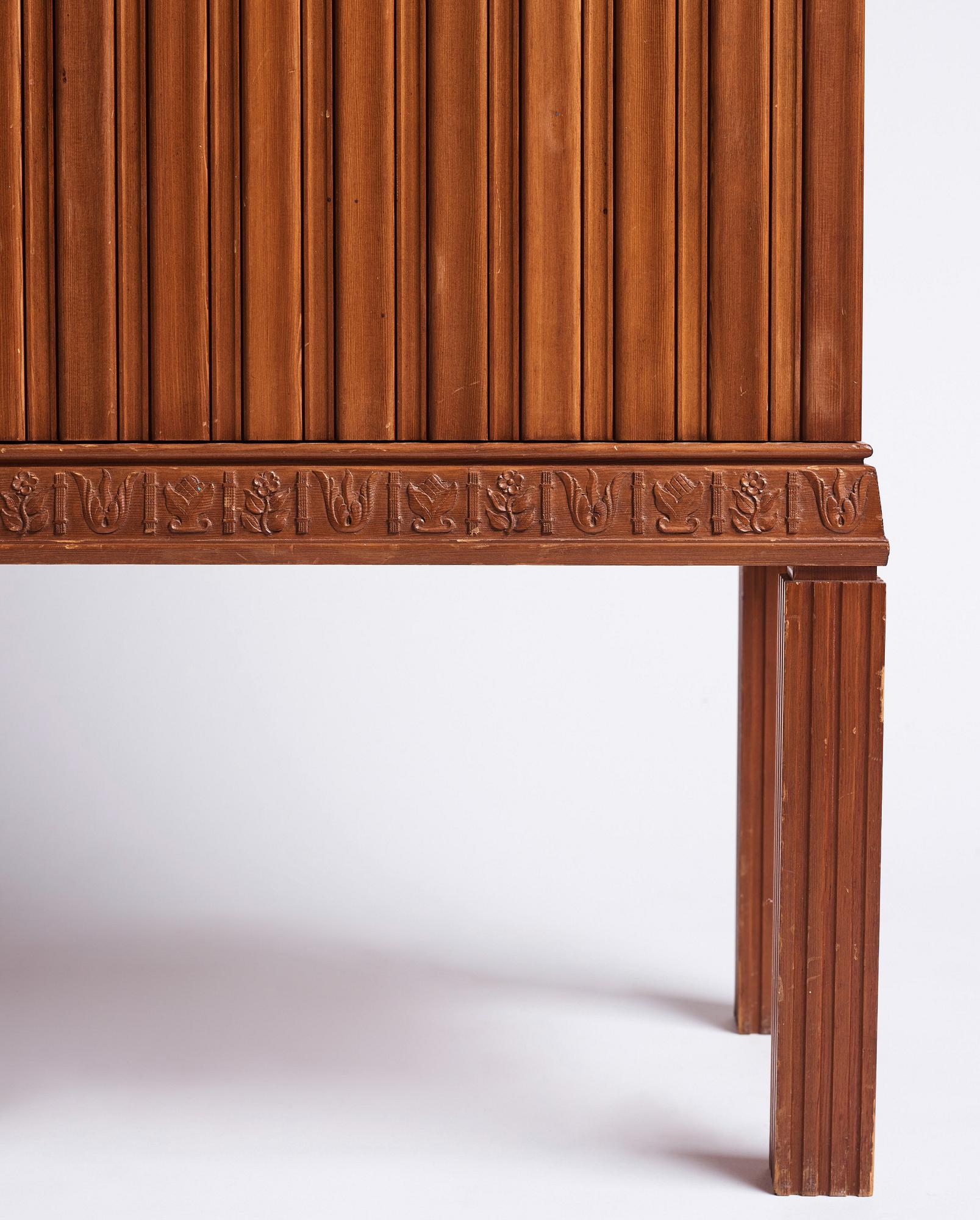 A Swedish Modern stained pine cabinet, 1940s.
