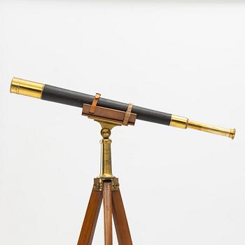 A 20th century telescope on a tripod.
