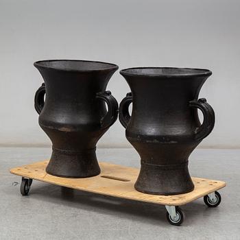 A pair of cast iron garden vases, 20th Century.