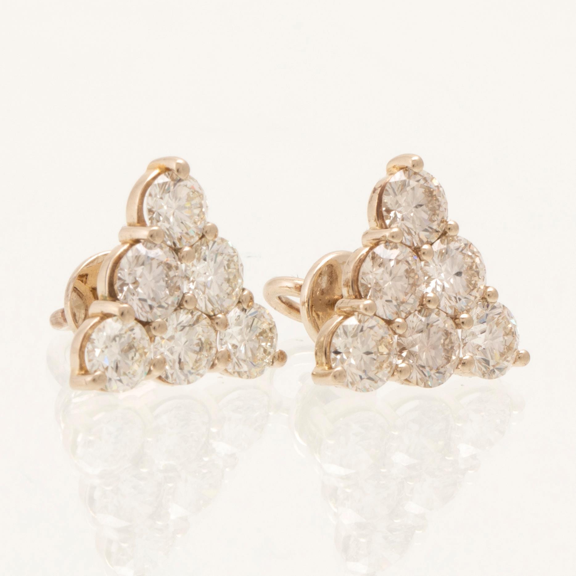 Earrings, a pair of 18K white gold with round brilliant-cut diamonds.