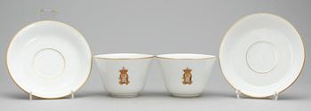TEKOPPAR, 2 st, porslin, Oskar II's monogram, märkta Toy, Chaussee d'Antin, Paris undertill, sent 1800-tal.