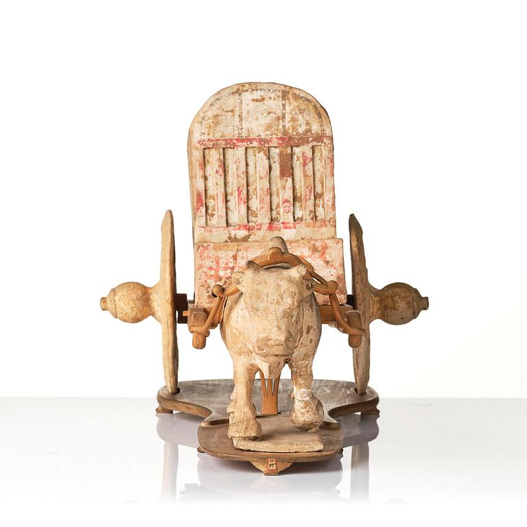 A pottery model of an ox with cart, Tang dynasty (618-907).