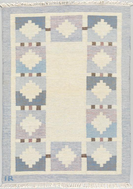 A flat weave carpet designed by Ida Rydelius from the second half of the 20th century.