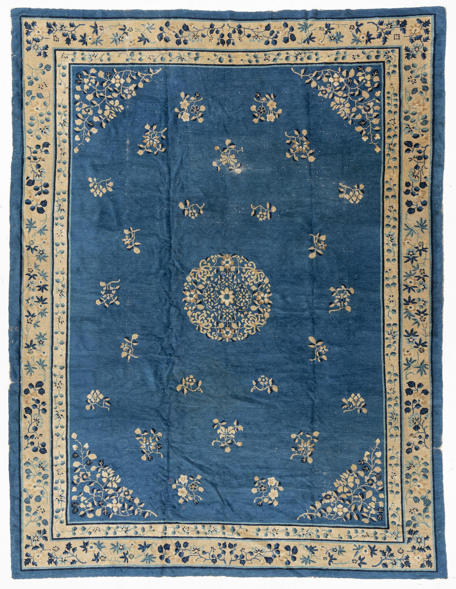 An antique Chinese carpet, c. 355 x 270 cm.