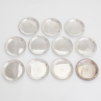 A 21-piece set of 'Chippendale' silver cutlery, and 11 silver coaster, Turku and Hämeenlinna, 1983-90 and 1964.