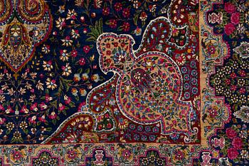 A semi-antique Kirman carpet, south Persia, c. 440 x 279 cm.