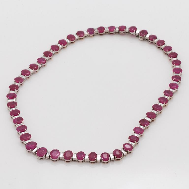 A ruby and baguette cut diamond rivière necklace by Demner New York. Total carat weight of diamonds circa 9.00 cts.
