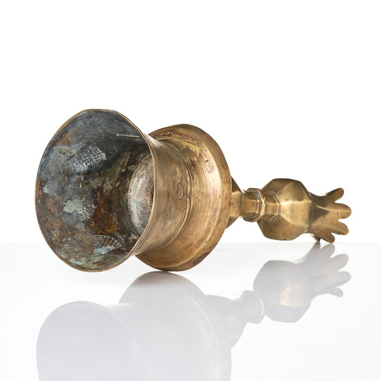 An Ottoman brass 'Tulip' Candelstick, Turkey, 17th/18th century.