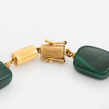 A 14K gold and malachite bracelet.