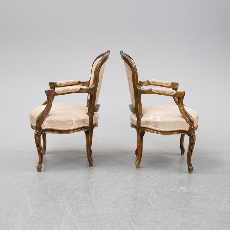 A pair of Louis XV-style arm chairs, 20th century.