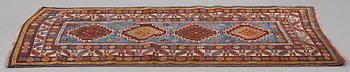 A RUG, a semi-antique Gendje probably, ca 209 x 124 cm.