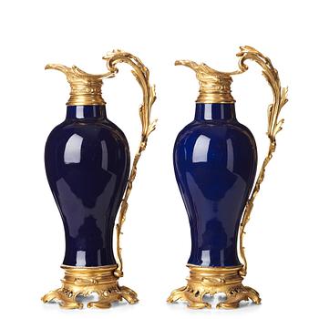 779. A pair of gilt bronze mounted vases, Qing dynasty, Qianlong (1736-95). French bronze mounts.