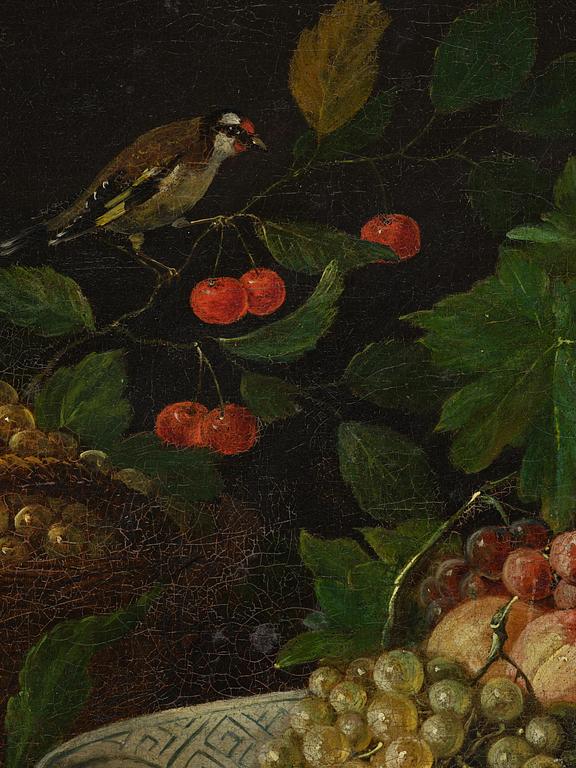 Joris van Son, follower of, Still life with a goldfinch, fruits, and a plate.