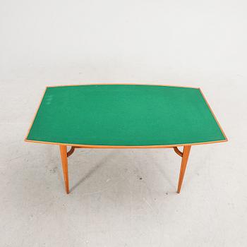 A 1960s teak coffee table.