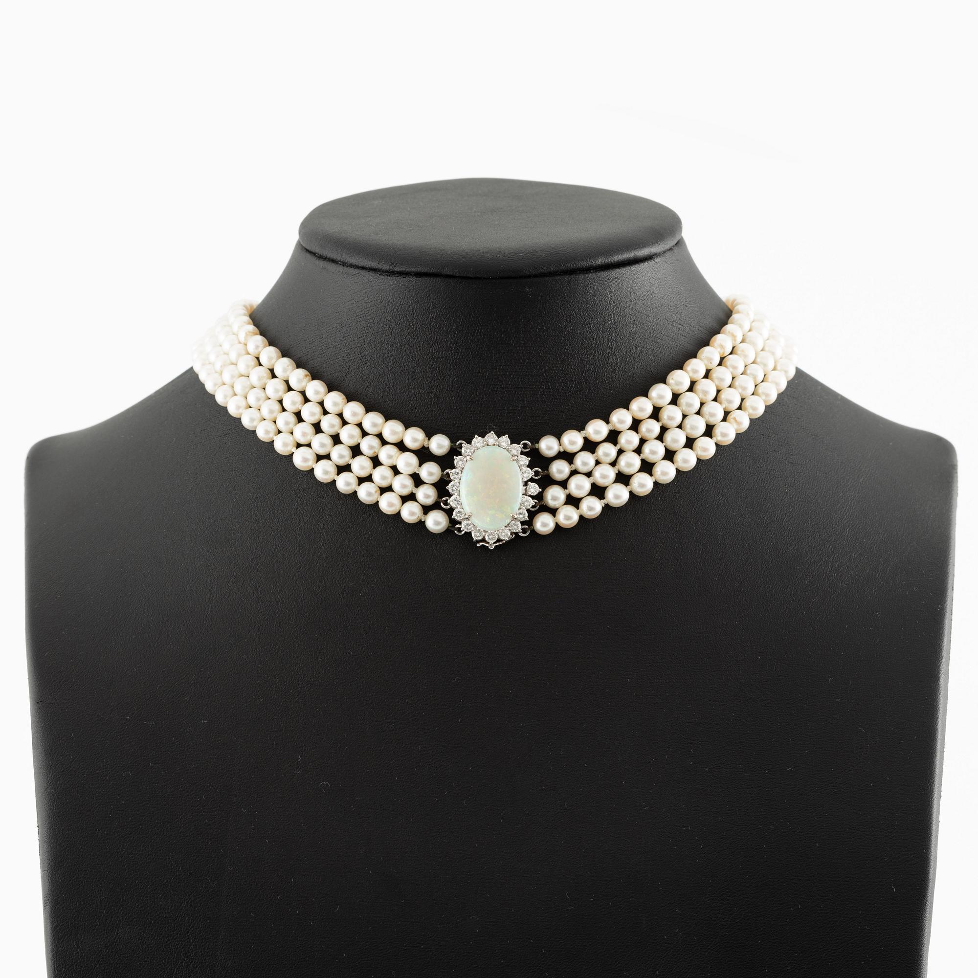 Necklace, four-row with cultured pearls, clasp 18K white gold set with opal and brilliant-cut diamonds.