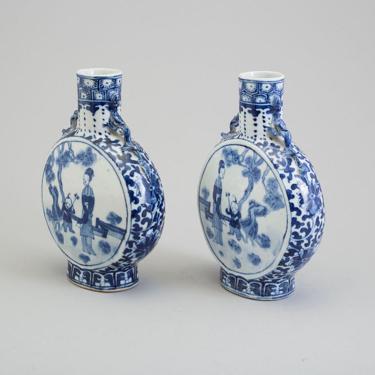 Two similar blue and white porcelain moon flasks, Qing dynasty, late 19th century.