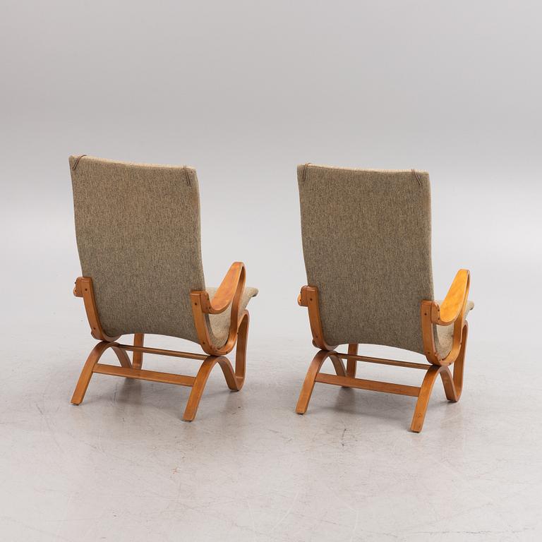 A pair of birch tree easy chairs. Mid 20th century.